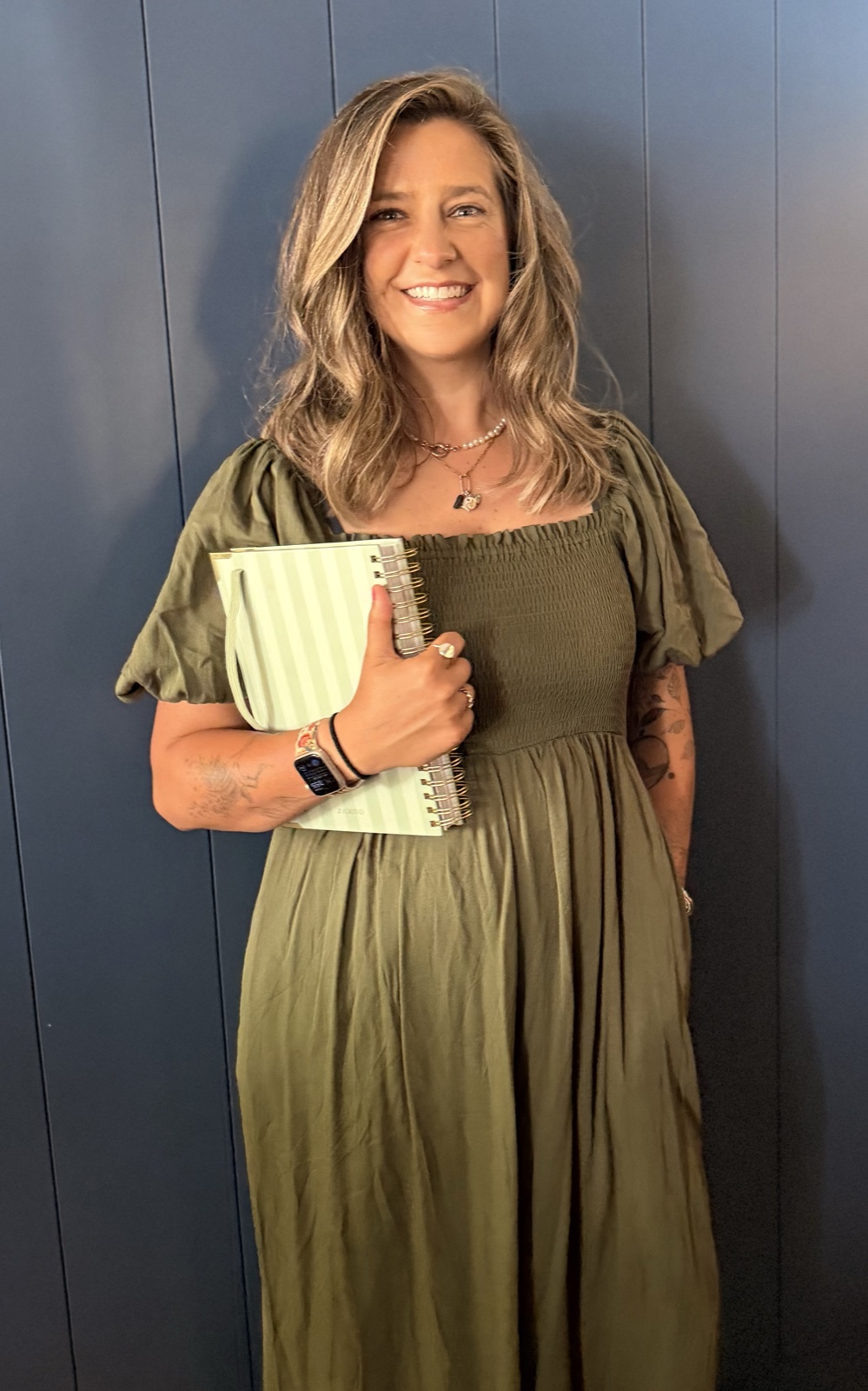 Cassidy Myers-Sims holding a notebook